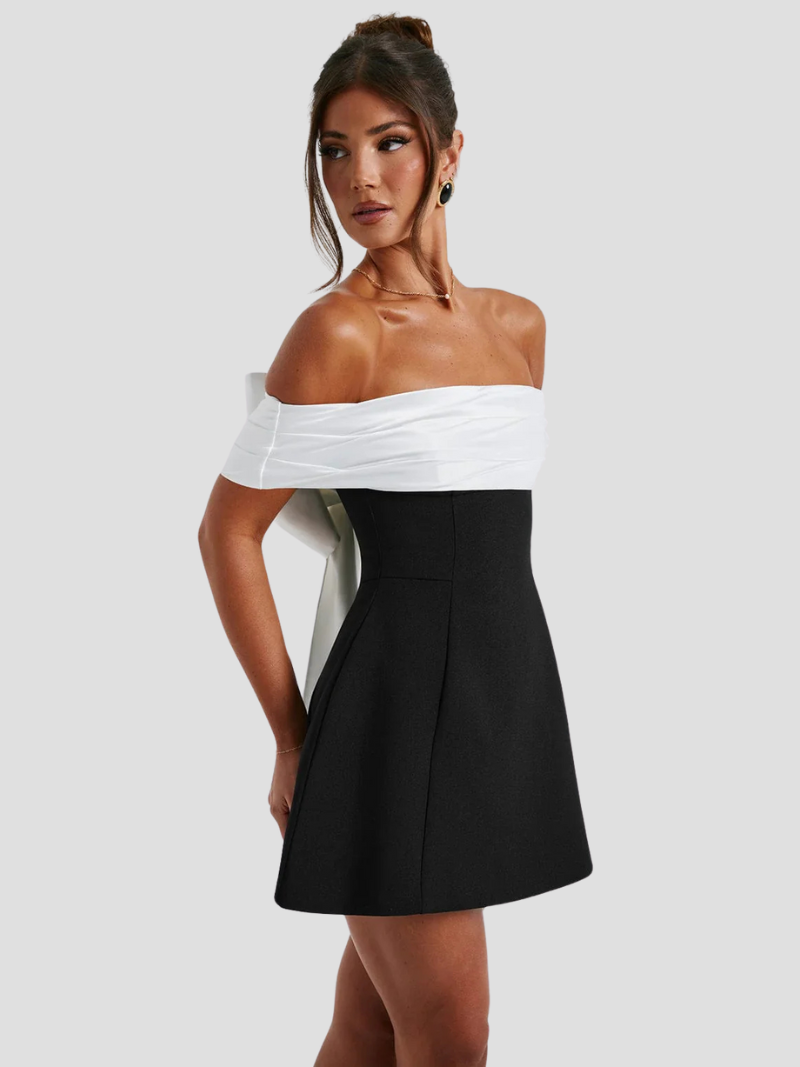 NOIRÉLLE | Zwart-witte mini-jurk met strikdetail en bardot-hals